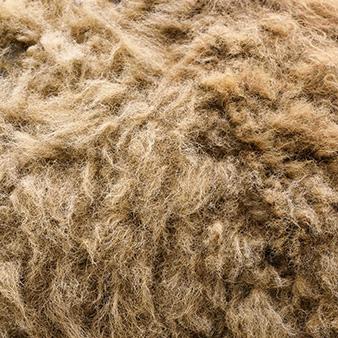 Aus dem Unterhaar der Yaks kommt die Wolle unserer Kleidung Nahaufnahme von Yakfell